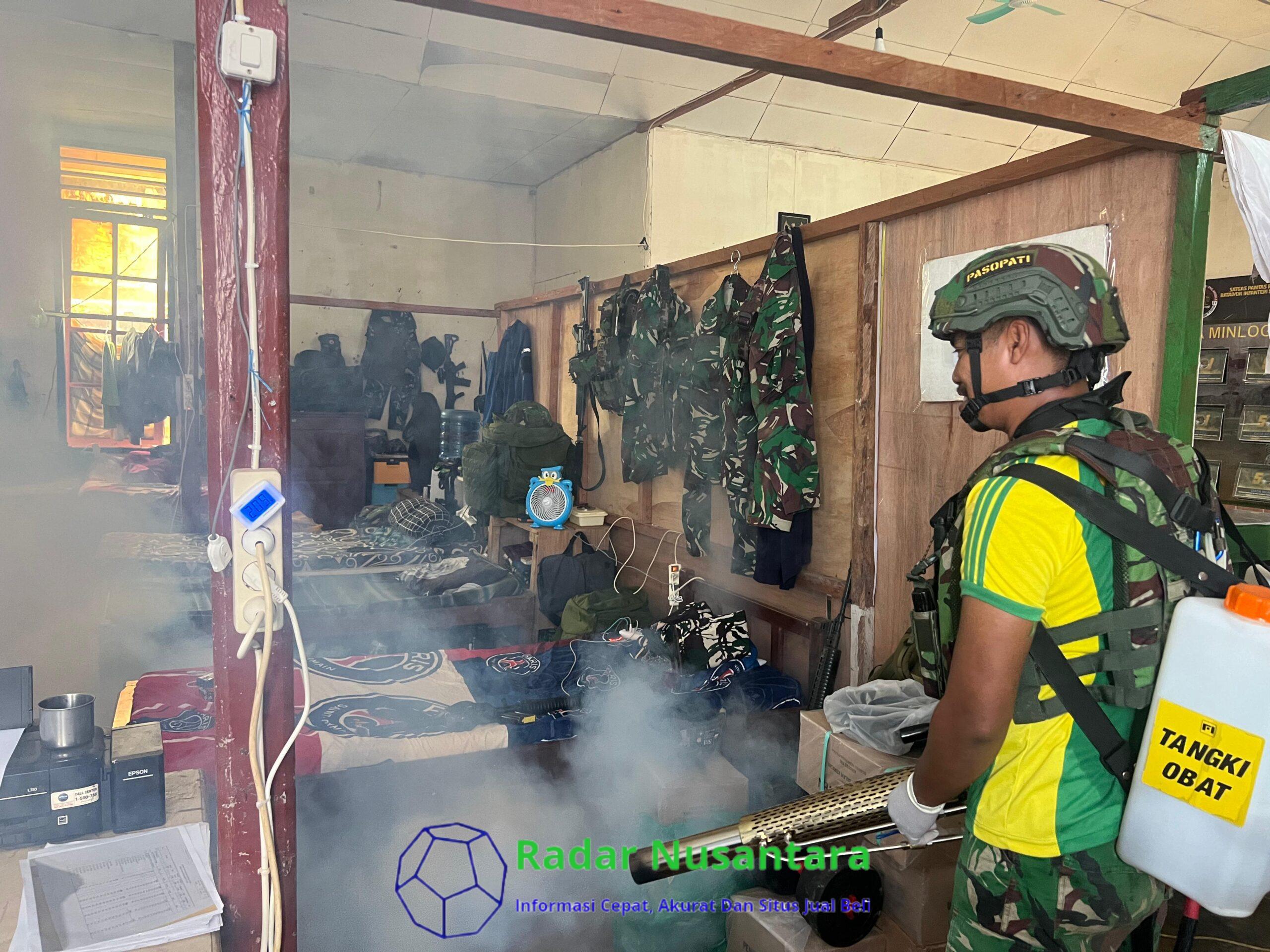 Satgas Habema Bersama Warga Kamat Kerja Bakti Fogging Gereja